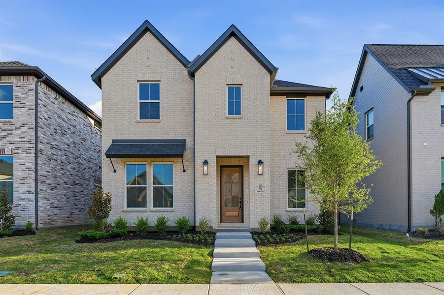 Front exterior of a new home in Light Farms Brenham - 40' Lots, Celina, TX, highlighting curb appeal (Image 2). Front exterior of a new home in Light Farms Brenham - 40' Lots, Celina, TX, highlighting curb appeal (Image 2).