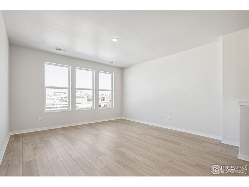 Spacious, unfurnished interior of a new home in Kinston Mainstreet Townhomes, Loveland (Image 31).
