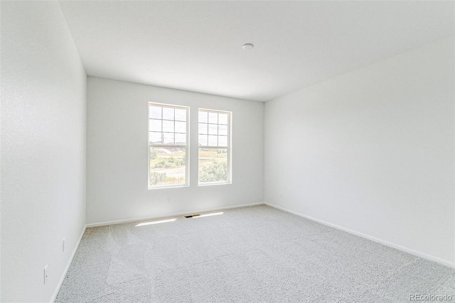 Spacious, unfurnished interior of a new home in Terrain Oak Valley, Castle Rock (Image 21).