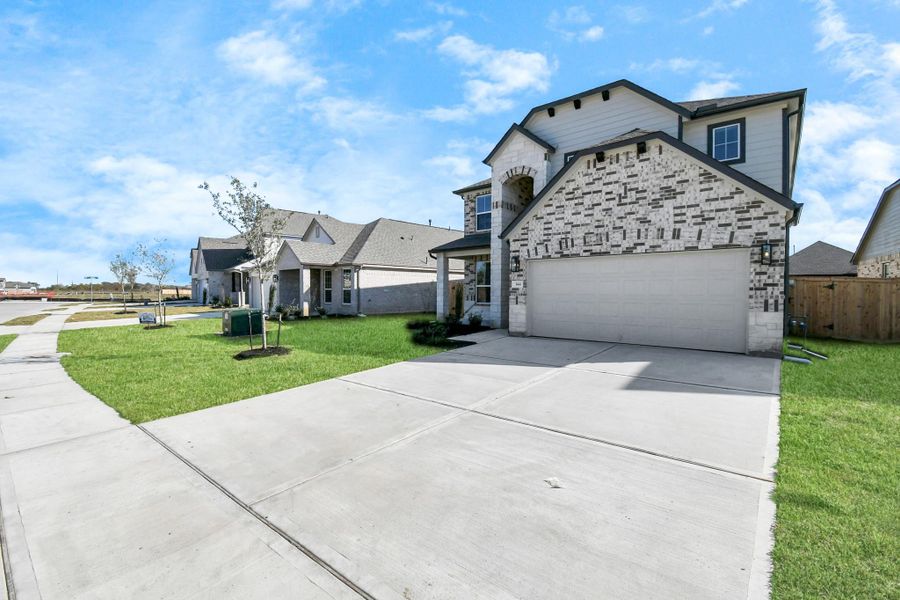 Home features a convenient 2-car garage complemented by aspacious driveway, offering ample parking for you and your guests. Home features a convenient 2-car garage complemented by aspacious driveway, offering ample parking for you and your guests.