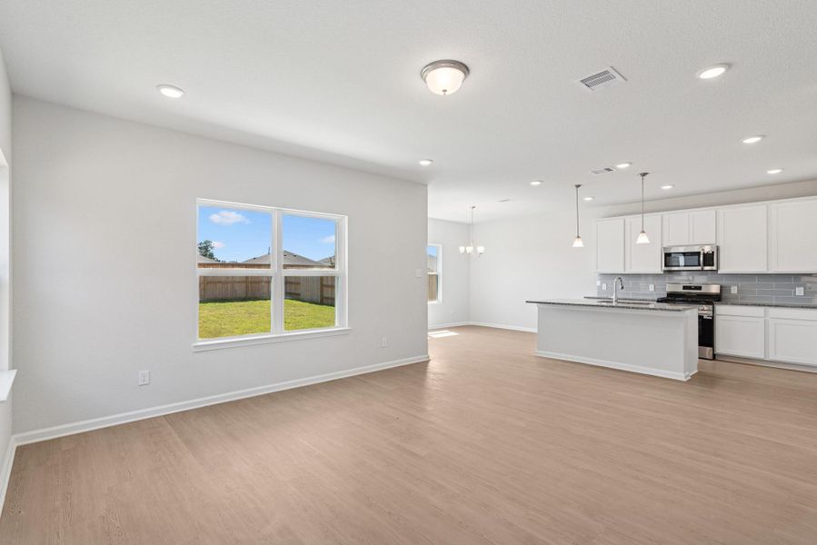 The Oriole II- Family Room into the Kitchen. Home under construction. Sample floor plan photo used for illustrative purposes only. Upgrades, selections options, and colors will vary. The Oriole II- Family Room into the Kitchen. Home under construction. Sample floor plan photo used for illustrative purposes only. Upgrades, selections options, and colors will vary.