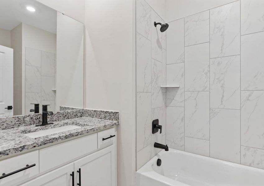 The secondary bathroom has a large soaking tub