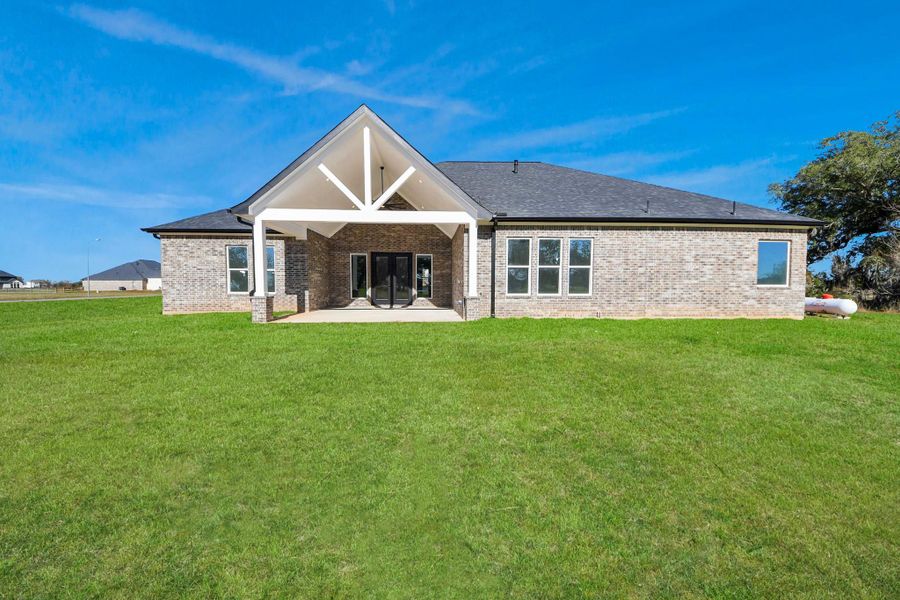 Generous backyard space extending from the patio