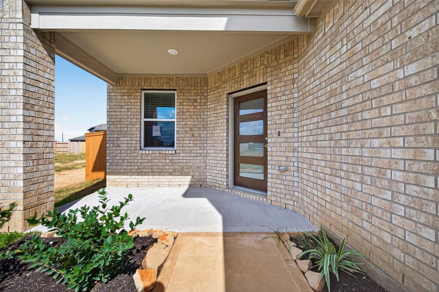 Exterior details and patio area of a home in Sunterra, Katy (Image 3).