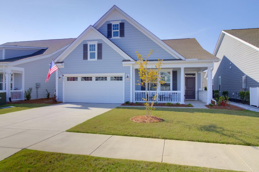 Front exterior of a new home in Cresswind Charleston, Summerville, SC, highlighting curb appeal (Image 22).