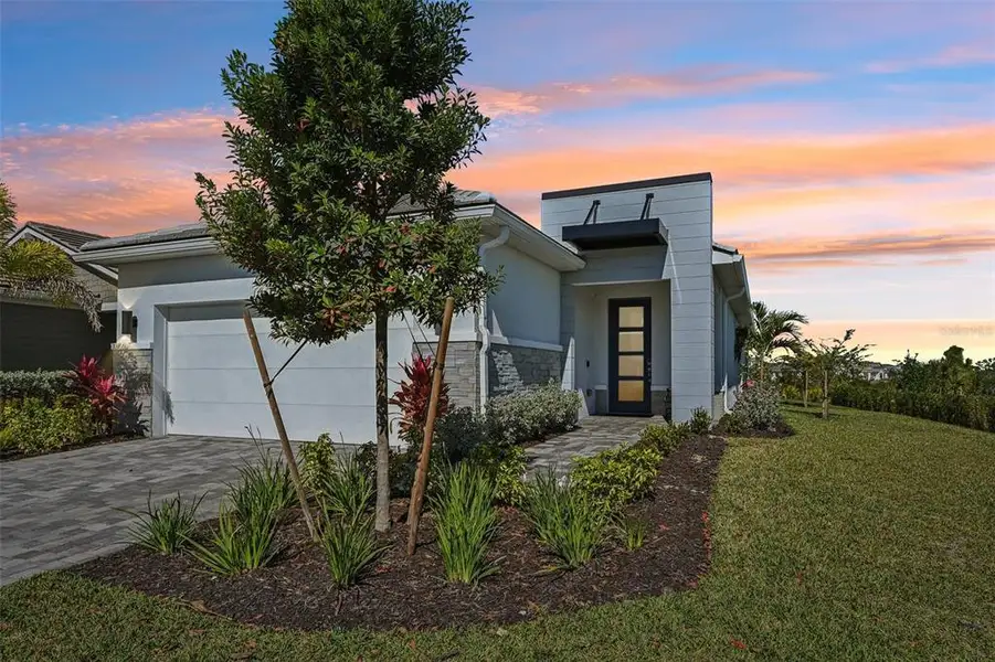 Front exterior of a new home in , Venice, FL, highlighting curb appeal (Image 23).