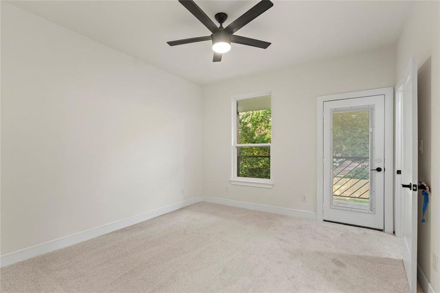 Empty room with ceiling fan and light colored carpet Empty room with ceiling fan and light colored carpet