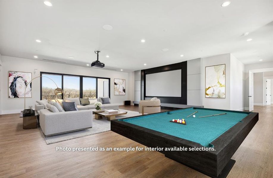 Game room with pool table and light hardwood / wood-style flooring