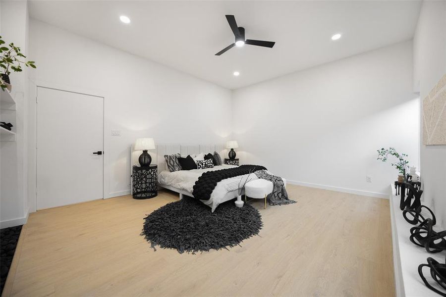Bedroom featuring light wood-style floors, recessed lighting, and a ceiling fan