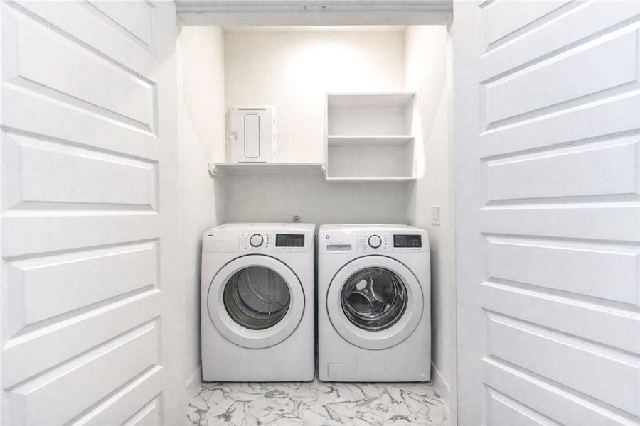 Utility room located on the third floor. (Washer & Dryer shown are virtually staged)