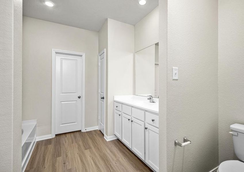 The master bathroom has a linen closet for extra storage.