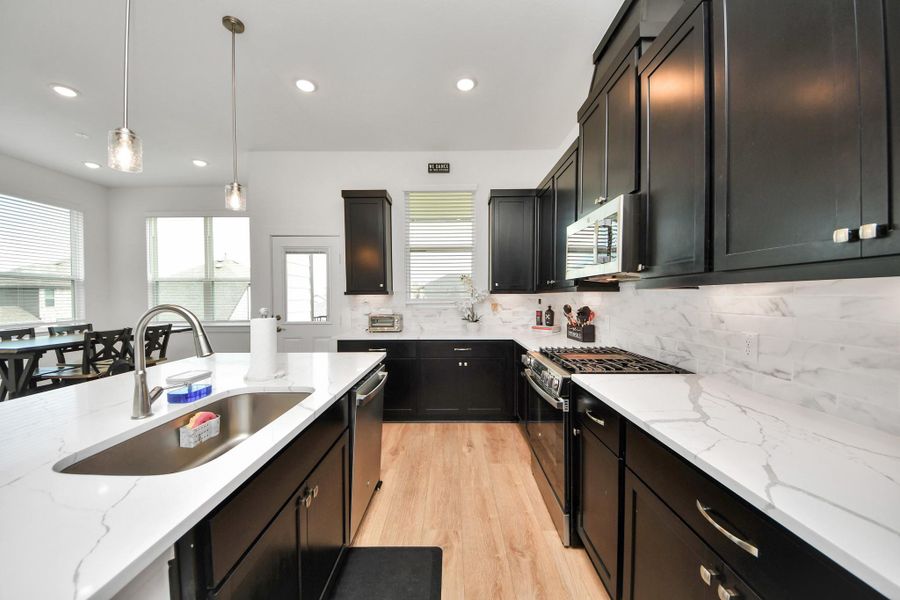 Furnished interior view inside a new home in Meridiana Courtyard Collection, Manvel (Image 6).