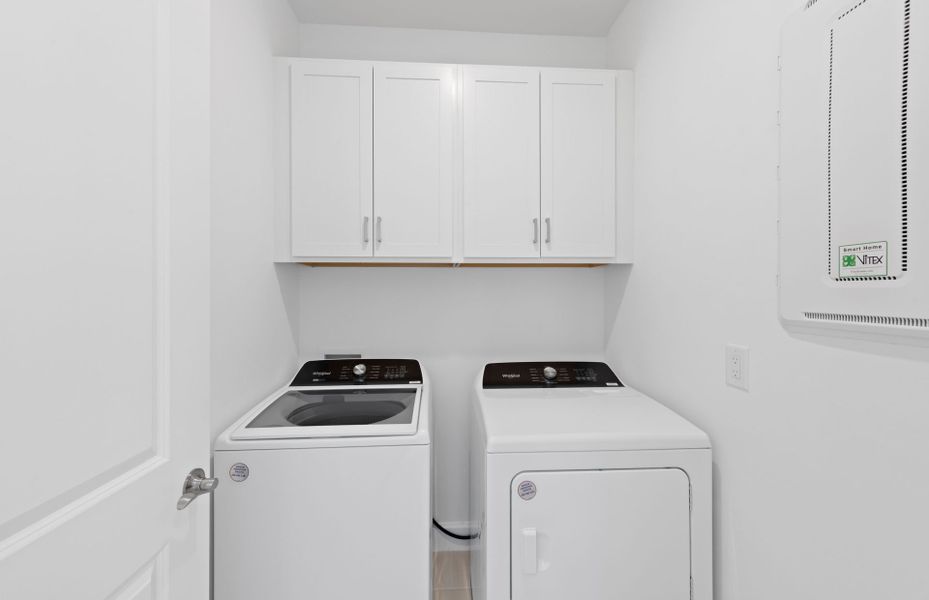 Spacious laundry room featuring storage space Spacious laundry room featuring storage space