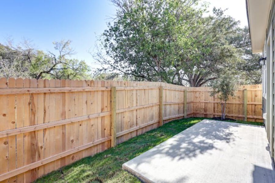 A wooden fence next to a road. A wooden fence next to a road.