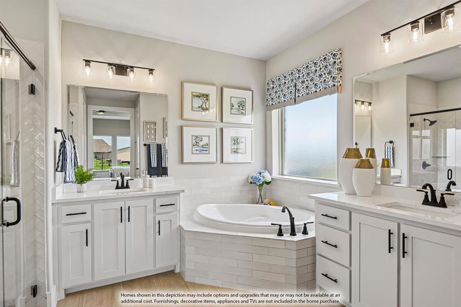Master bathroom with dual vanities, corner soaking tub, white cabinets, and black fixtures Master bathroom with dual vanities, corner soaking tub, white cabinets, and black fixtures