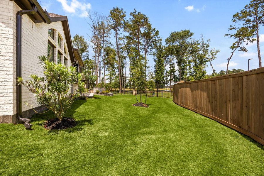 Exterior details and patio area of a home in The Highlands, Porter (Image 33).