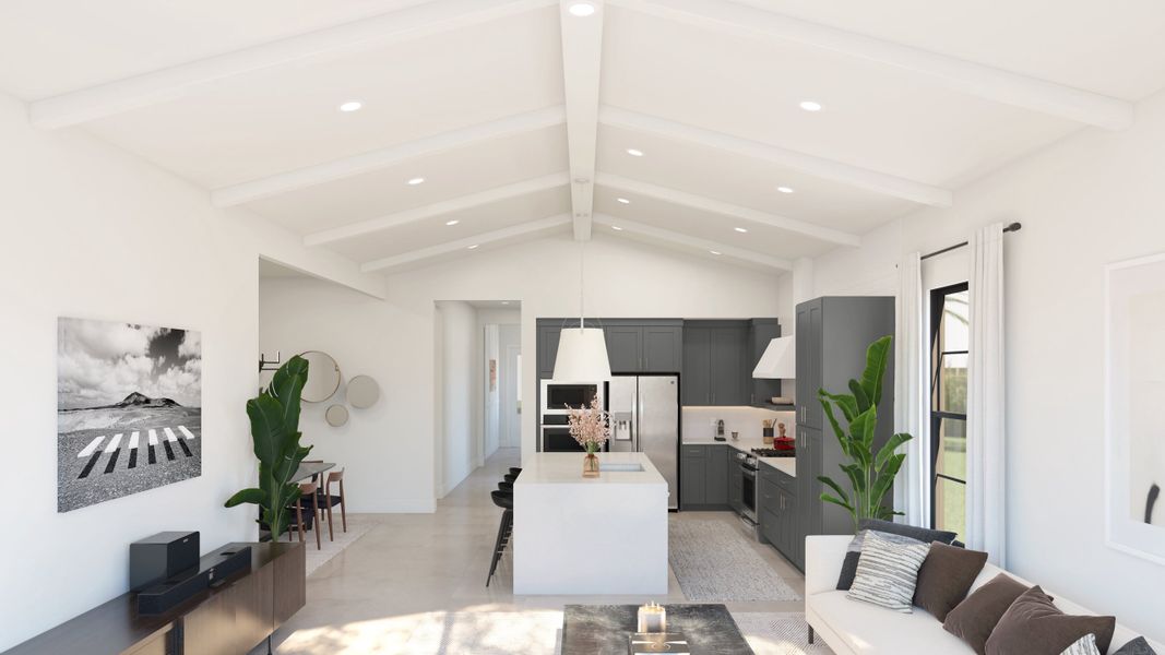 Great room with vaulted ceiling and white-stained ceiling beams