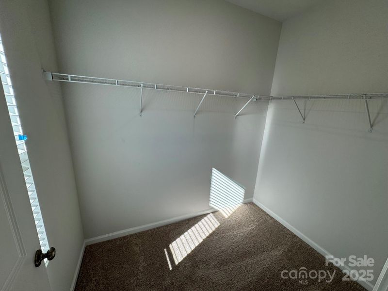 Primary Closet with window Primary Closet with window