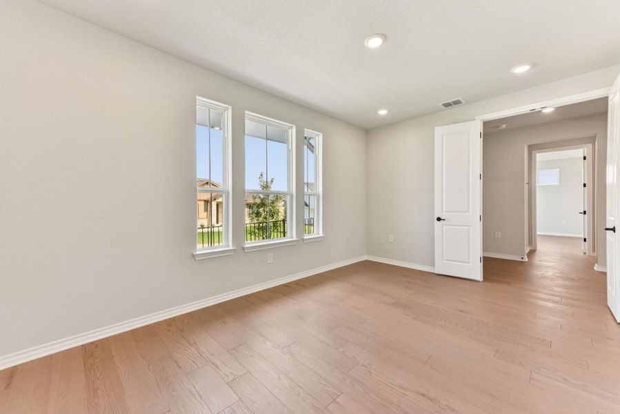 Spare room featuring light wood-style flooring and recessed lighting