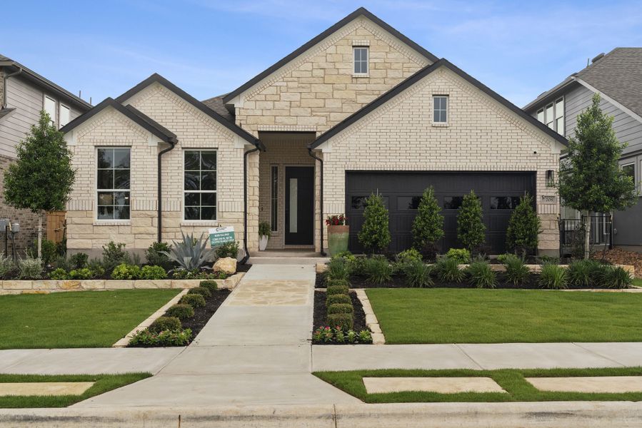 Front exterior of a new home in Nolina, Georgetown, TX, highlighting curb appeal (Image 26). Front exterior of a new home in Nolina, Georgetown, TX, highlighting curb appeal (Image 26).