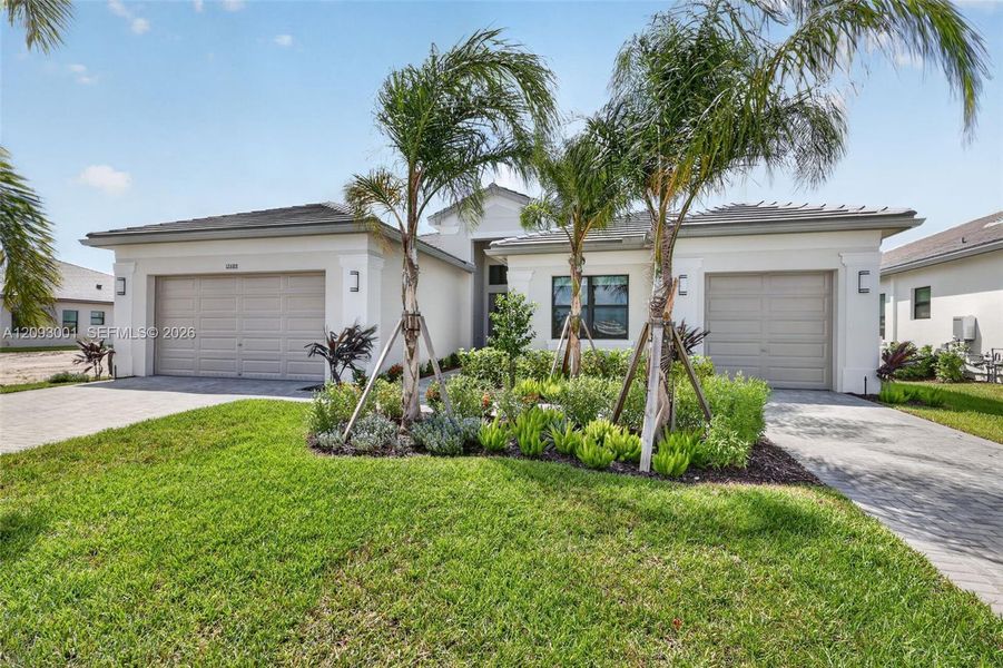 Front exterior of a new home in , Port St. Lucie, FL, highlighting curb appeal (Image 23). Front exterior of a new home in , Port St. Lucie, FL, highlighting curb appeal (Image 23).
