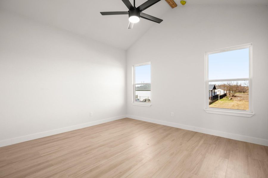 Spare room with light wood-style flooring and ceiling fan