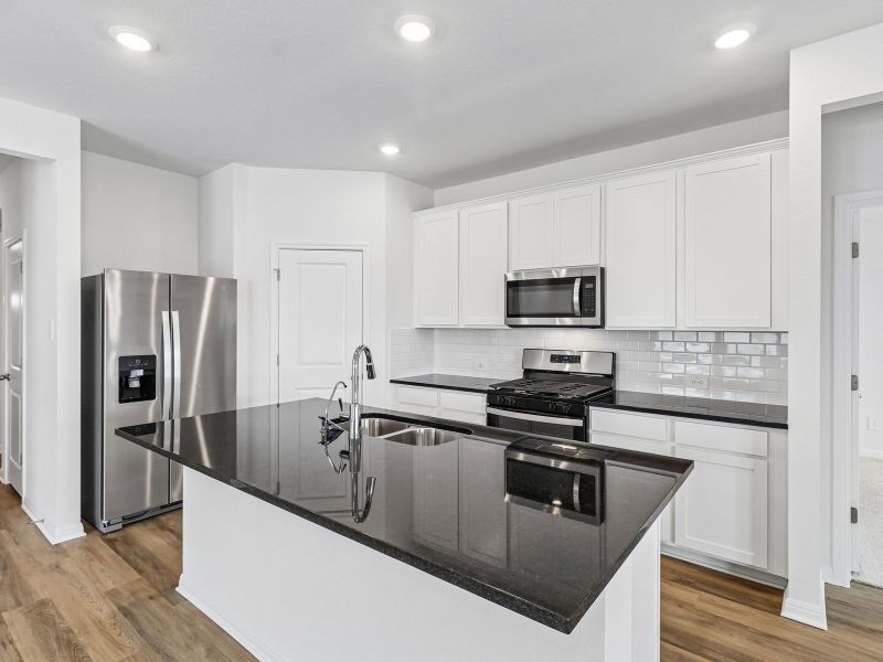 Furnished interior view inside a new home in Riverbend at Double Eagle - Reserve Collection, Cedar Creek (Image 5).