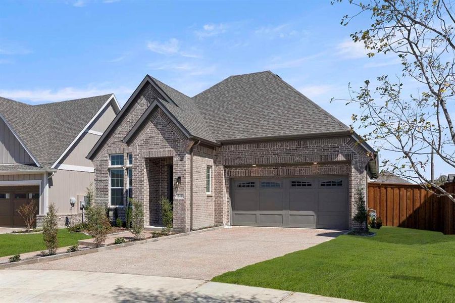 Front exterior of a new home in Inspiration, Lucas, TX, highlighting curb appeal (Image 1).