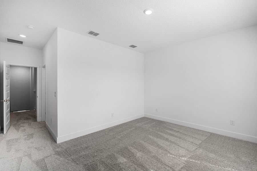 Spacious, unfurnished interior of a new home in Harvest at Ovation - Townhomes, Winter Garden (Image 22).