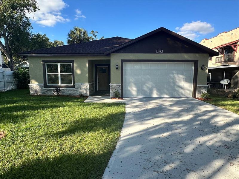 Front exterior of a new home in , Lake Wales, FL, highlighting curb appeal (Image 2).