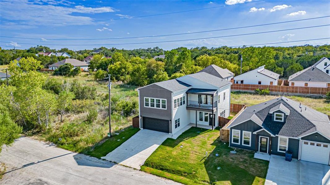 Front exterior of a new home in , Granbury, TX, highlighting curb appeal (Image 1). Front exterior of a new home in , Granbury, TX, highlighting curb appeal (Image 1).