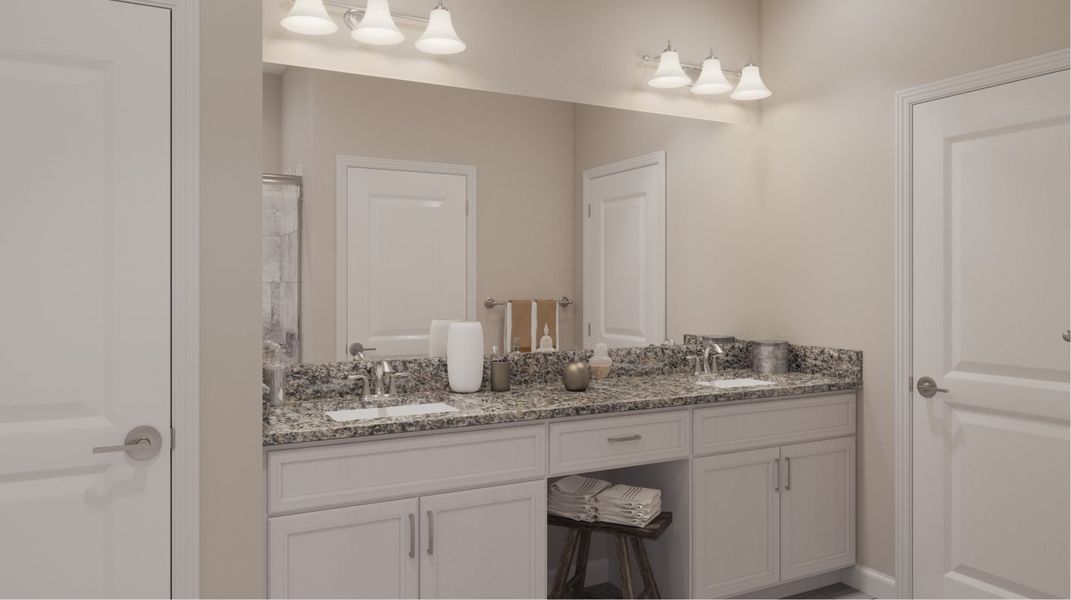 Full wall-width mirror atop a granite vanity