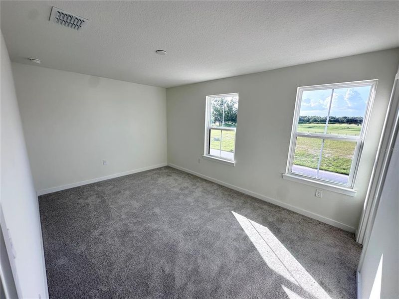 Spacious, unfurnished interior of a new home in Grasslands West, Lakeland (Image 18).