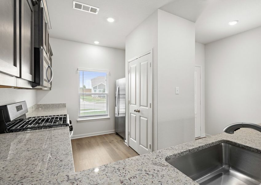 The kitchen has a pantry. The kitchen has a pantry.