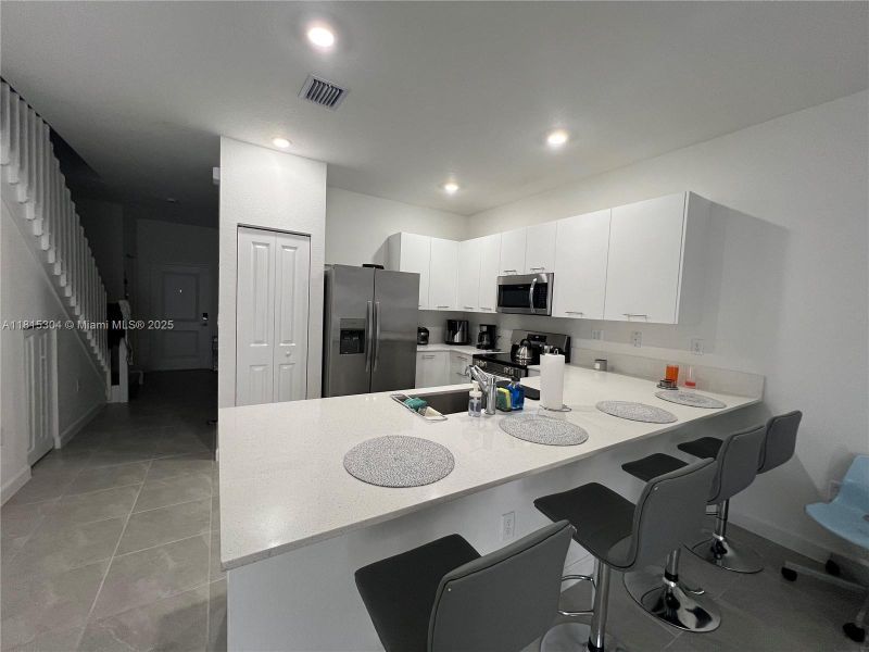 Furnished interior view inside a new home in , Miami Gardens (Image 9).