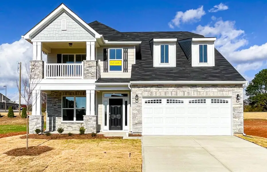 Front exterior of a new home in Founders Club, Moore, SC, highlighting curb appeal (Image 1).
