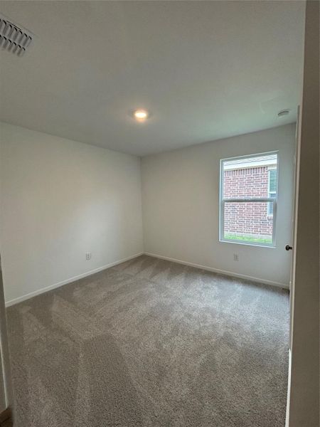 Spacious, unfurnished interior of a new home in Avalon Ridge: Cottage, Conroe (Image 22).
