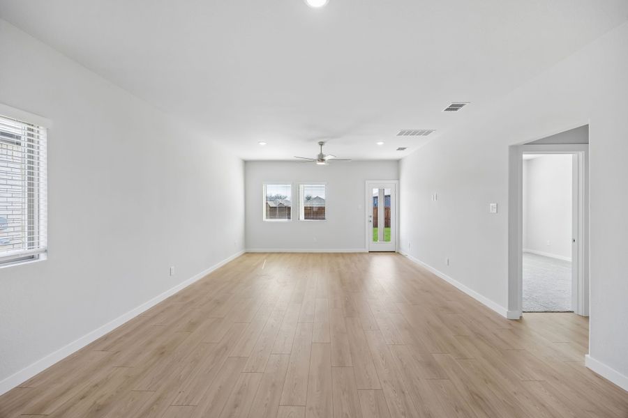 Living and Dining Rooms in the Mesquite home plan by Trophy Signature Homes – REPRESENTATIVE PHOTO