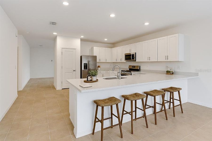 Furnished interior view inside a new home in Waterstone, Groveland (Image 6). Furnished interior view inside a new home in Waterstone, Groveland (Image 6).