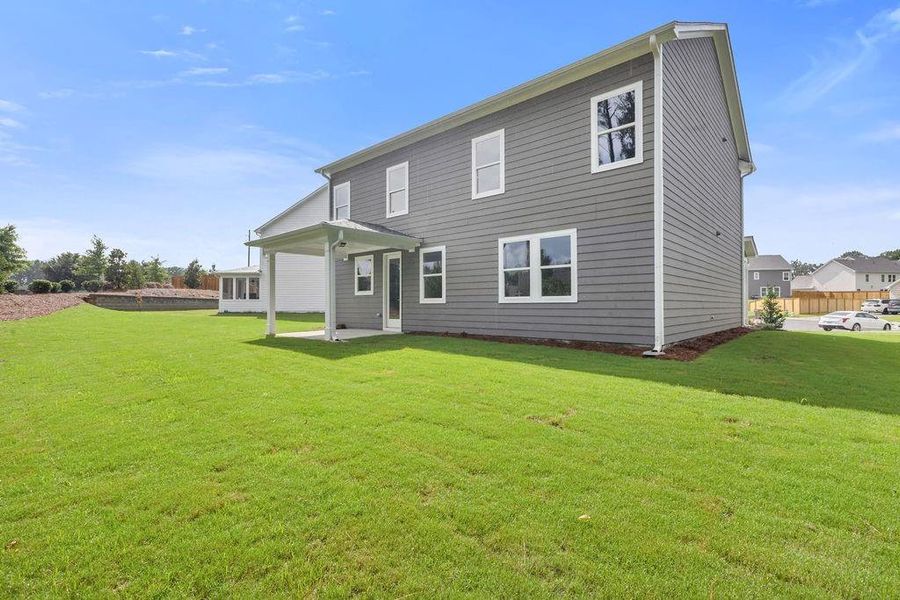 Exterior details and patio area of a home in Maddox Landing, Hoschton (Image 3).