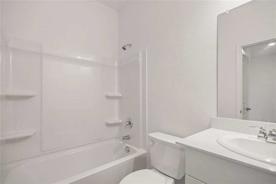Full bathroom offering clean finishes, ample counter space, and built-in storage.