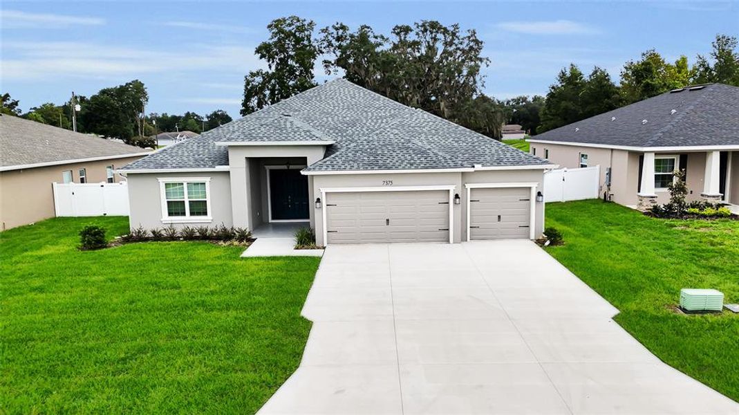 Front exterior of a new home in , Ocala, FL, highlighting curb appeal (Image 27).
