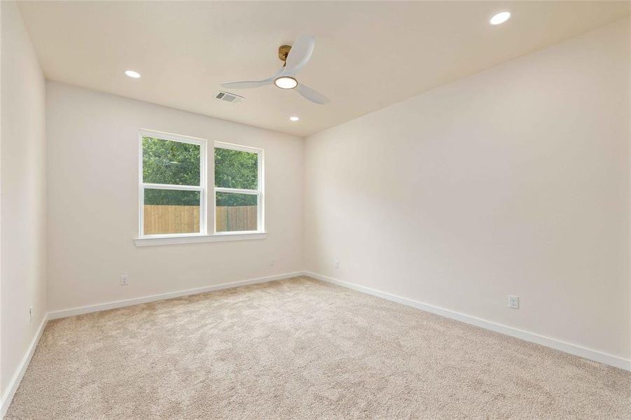 Spare room with light carpet, recessed lighting, and ceiling fan Spare room with light carpet, recessed lighting, and ceiling fan