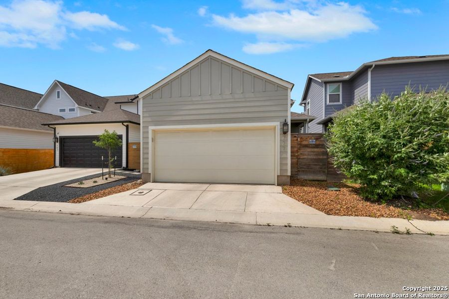 Front exterior of a new home in Town Creek, New Braunfels, TX, highlighting curb appeal (Image 15). Front exterior of a new home in Town Creek, New Braunfels, TX, highlighting curb appeal (Image 15).