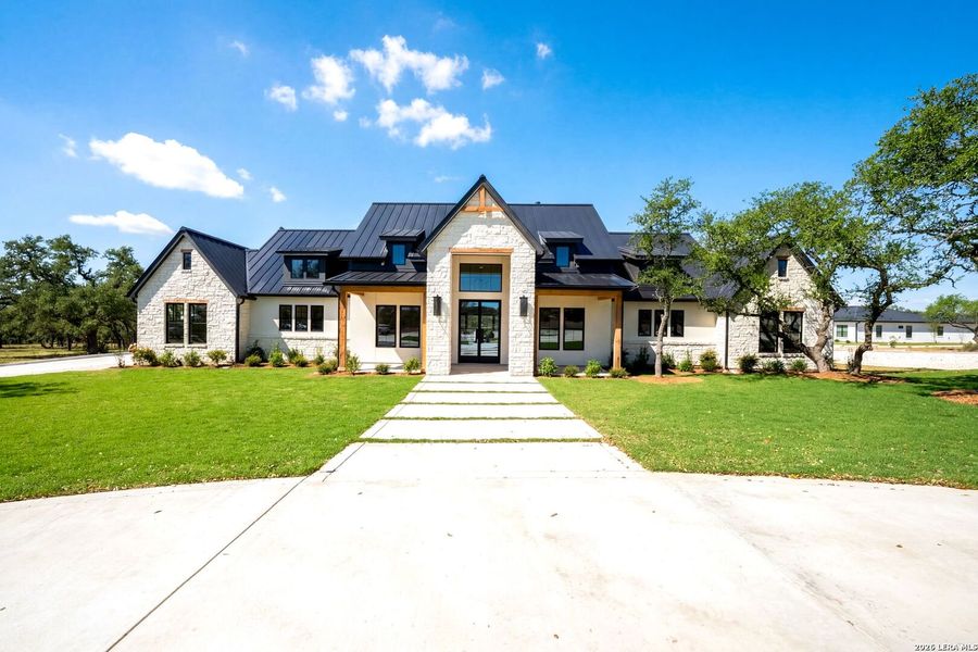 Front exterior of a new home in , Bulverde, TX, highlighting curb appeal (Image 1). Front exterior of a new home in , Bulverde, TX, highlighting curb appeal (Image 1).