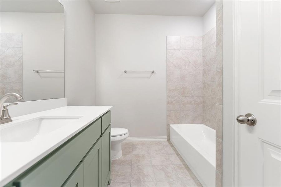 Bathroom with vanity and light tile patterned floors Bathroom with vanity and light tile patterned floors