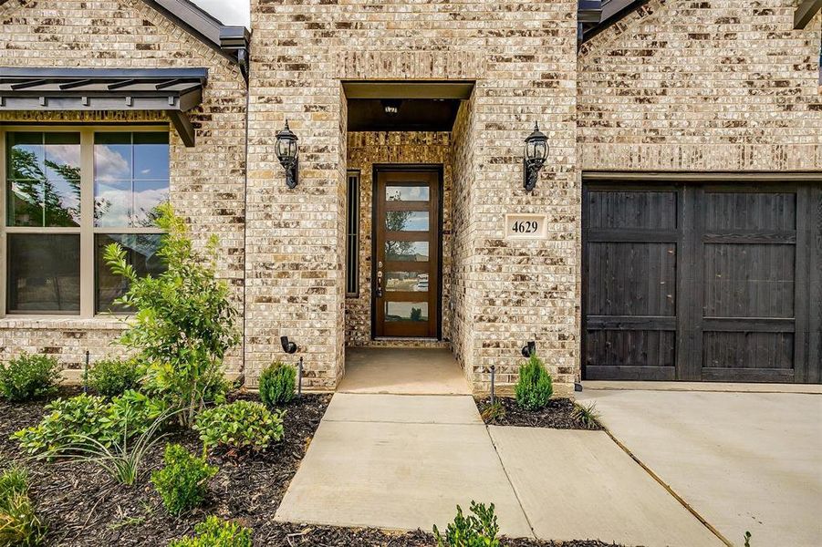 Property entrance featuring a garage