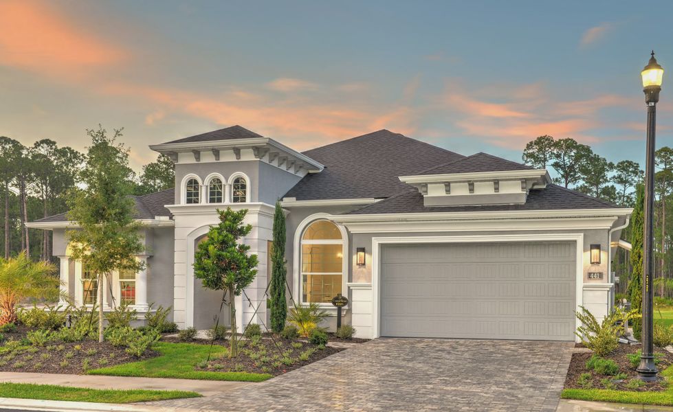 Front exterior of a new home in Plantation Bay, Ormond Beach, FL, highlighting curb appeal (Image 2).