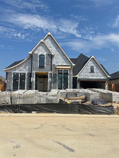Front exterior of a new home in Dunham Pointe 70', Cypress, TX, highlighting curb appeal (Image 2). Front exterior of a new home in Dunham Pointe 70', Cypress, TX, highlighting curb appeal (Image 2).