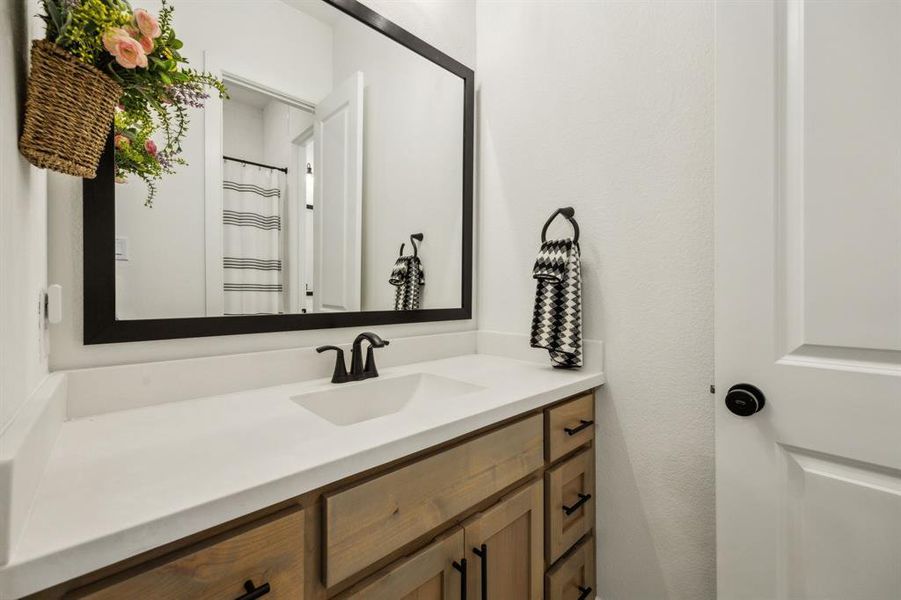 Full bath featuring vanity
